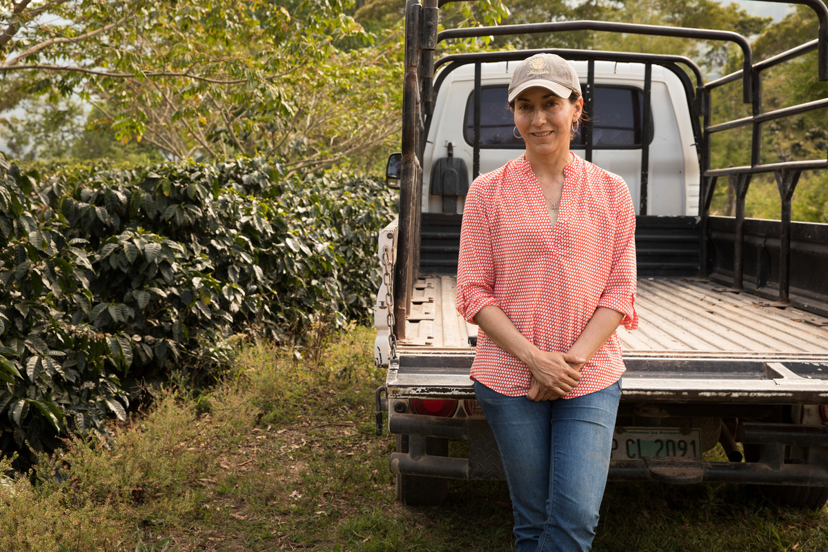 Coffee farmer standing next to truck